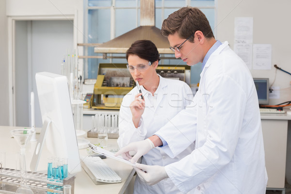 Scientists working attentively with computer Stock photo © wavebreak_media