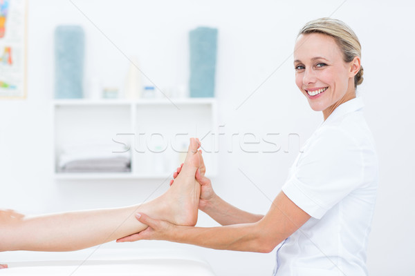 Stock photo: Physiotherapist doing foot massage