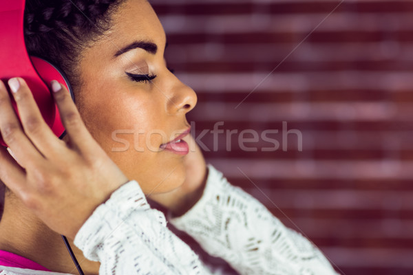 Young woman enjoying her music Stock photo © wavebreak_media