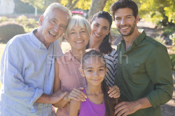 Stock photo: Happy family standing together in the park