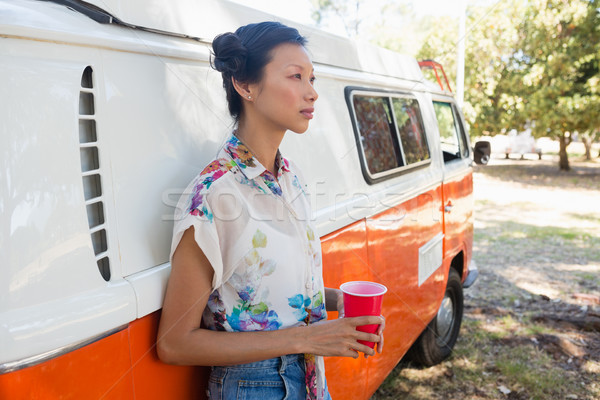 Woman leaning on camper van in the park Stock photo © wavebreak_media
