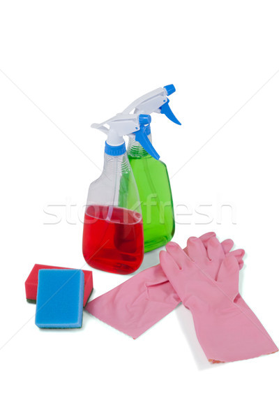 Detergent spray bottles, sponge pad and rubber glove on white background Stock photo © wavebreak_media