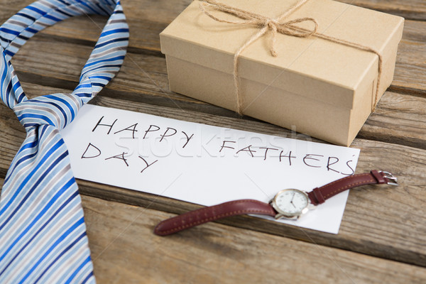 High angle view of fathers day greeting by gifts on table Stock photo © wavebreak_media