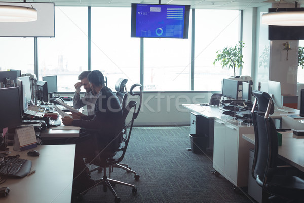 Side view of male business colleagues working together in office Stock photo © wavebreak_media