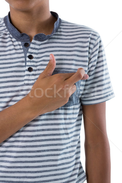 Teenage boy holding her fingers crossed Stock photo © wavebreak_media