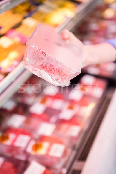 Stock photo: Smiling woman taking meal in the aisle