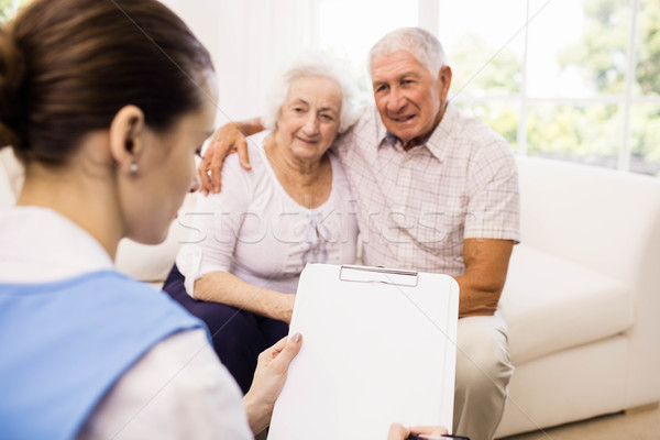 Nurse taking care of sick elderly patients Stock photo © wavebreak_media