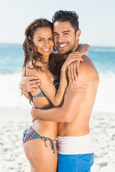 Happy couple hugging on the beach  Stock photo © wavebreak_media