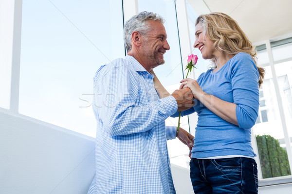Mature man giving rose to woman Stock photo © wavebreak_media