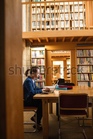 Student using laptop in library Stock photo © wavebreak_media