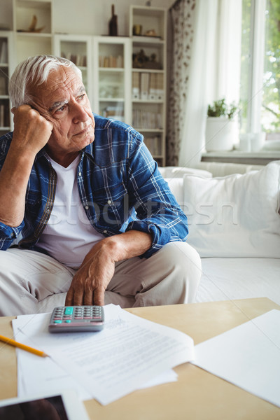 Worried senior man sitting on a sofa Stock photo © wavebreak_media