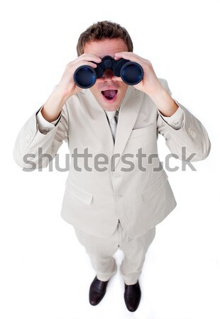 Surprised businesswoman looking through binoculars Stock photo © wavebreak_media