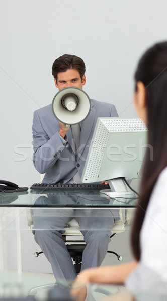 Businessman giving instructions with a megaphone  Stock photo © wavebreak_media