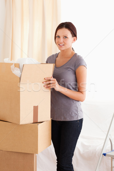 A female is packing a cardboard Stock photo © wavebreak_media