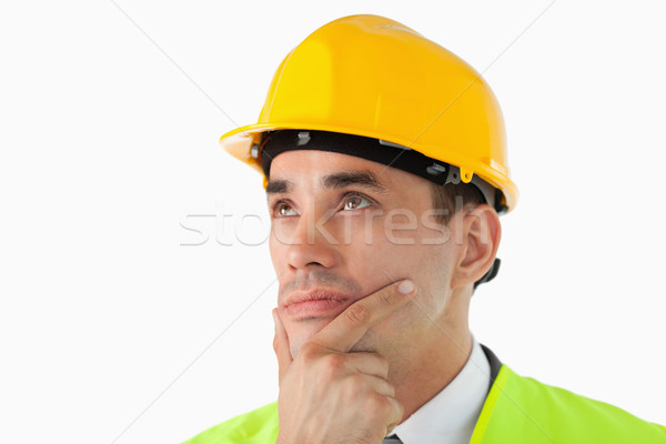 Close up of thinking architect looking to the side against a white background Stock photo © wavebreak_media