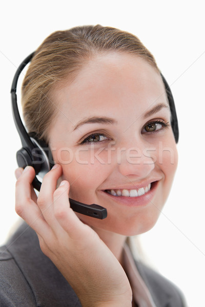 Stock photo: Happy smiling call center agent at work against a white background