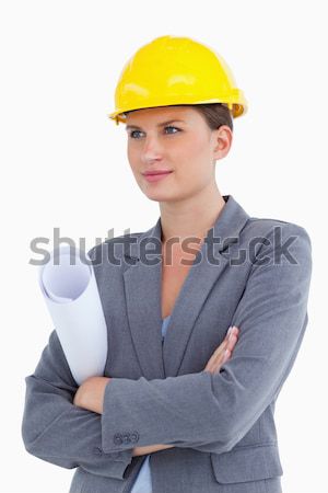 Close up of female architect with helmet and plans against a white background Stock photo © wavebreak_media