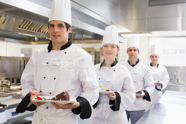 Chef's team bringing the dessert in the kitchen  Stock photo © wavebreak_media