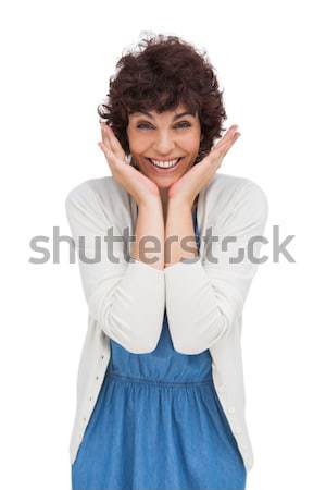 Astonished brunette woman standing and smiling Stock photo © wavebreak_media