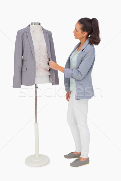 Fashion designer adjusting blazer on mannequin Stock photo © wavebreak_media