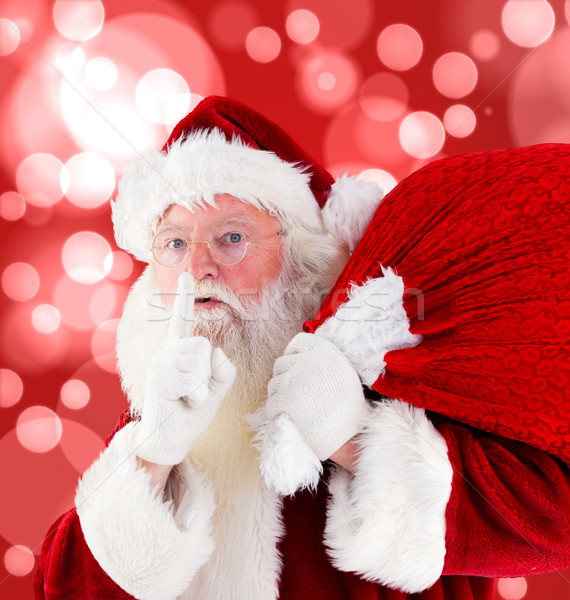 Composite image of santa claus carrying sack Stock photo © wavebreak_media