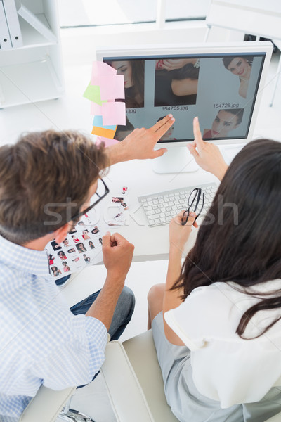 Rear view of casual photo editors working on computer Stock photo © wavebreak_media