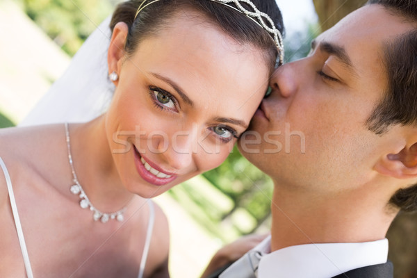 Bride being kissed by groom in garden Stock photo © wavebreak_media