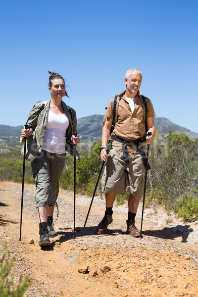 Heureux randonnée couple marche montagne sentier [[stock_photo]] © wavebreak_media