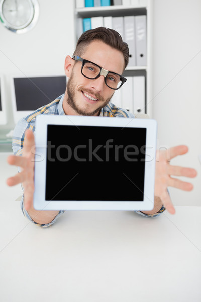Nerdy businessman showing tablet pc screen Stock photo © wavebreak_media