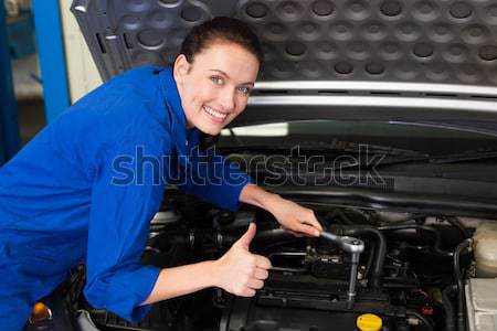 Mechanic smiling at the camera Stock photo © wavebreak_media