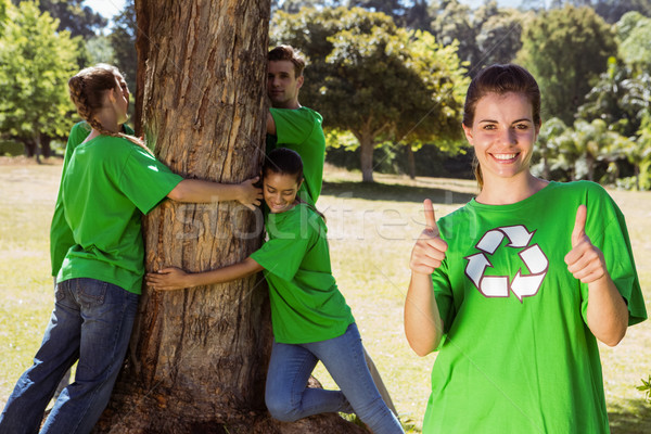 Environmental activists hugging a tree in the park Stock photo © wavebreak_media