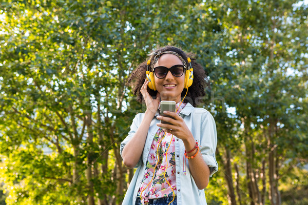 Pretty hipster listening to music Stock photo © wavebreak_media