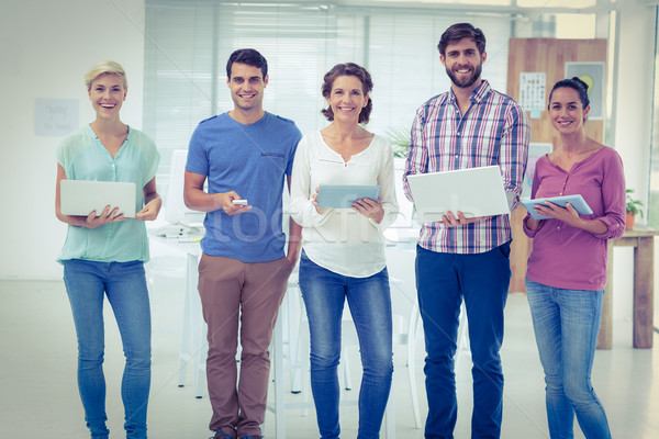 Stock photo: Creative colleagues with laptop and digital tablet office