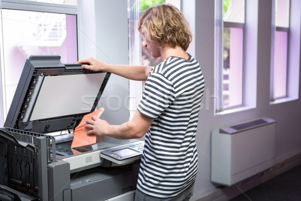Student photocopying his book in the library Stock photo © wavebreak_media