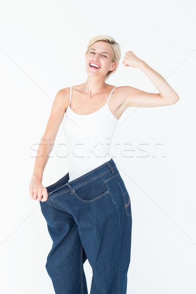 [[stock_photo]]: Femme · souriante · grand · jeans · blanche · corps