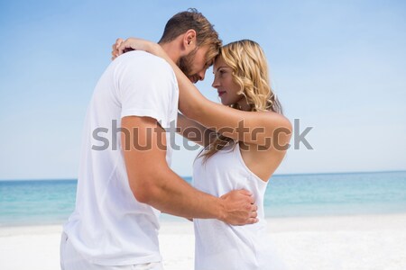 Casal braço em torno de relaxante praia Foto stock © wavebreak_media