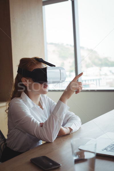 Businesswoman anticipating while using virtual reality technology at office Stock photo © wavebreak_media