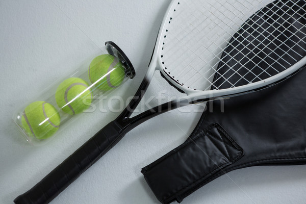 High angle view of tennis racket by balls in container Stock photo © wavebreak_media