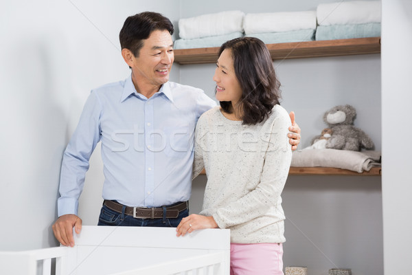 Happy couple near crib Stock photo © wavebreak_media