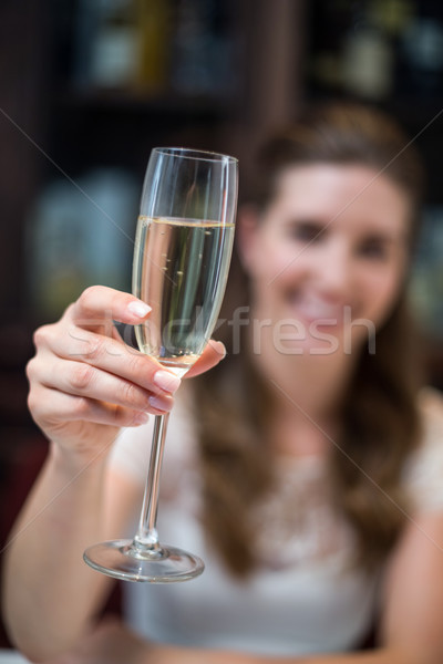 Glücklich Frau halten Champagner Flöte Stock foto © wavebreak_media