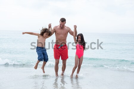 Père enfants plage mer rive [[stock_photo]] © wavebreak_media