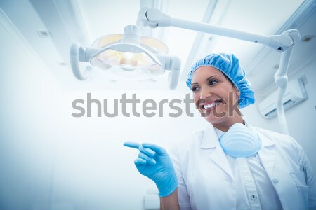 Portrait of male nurse adjusting iv drip in operation theater Stock photo © wavebreak_media