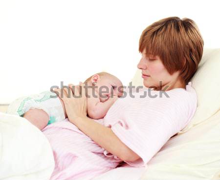 Mother kissing her newborn baby Stock photo © wavebreak_media