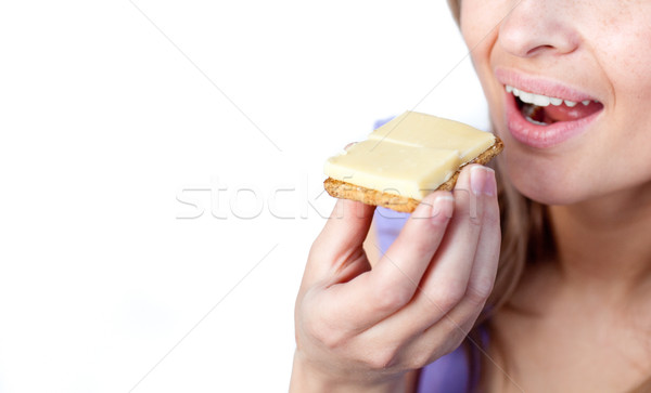 Close-up of a woman eating a cracker with cheese  Stock photo © wavebreak_media