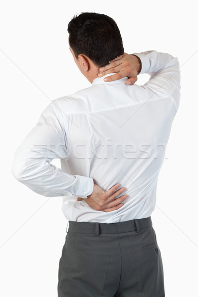 Portrait of the painful back of a businessman against a white background Stock photo © wavebreak_media