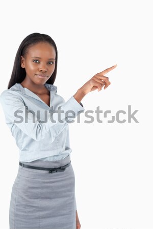 Portrait of a cute businesswoman pressing an invisible key against a white background Stock photo © wavebreak_media