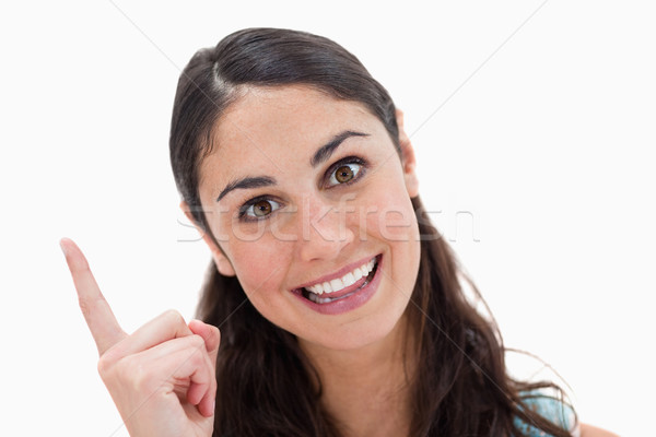 Stock photo: Woman having an idea against a white background