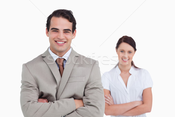 Smiling businessteam with arms crossed against a white background Stock photo © wavebreak_media