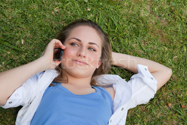 Jeunes fille Retour téléphone portable [[stock_photo]] © wavebreak_media