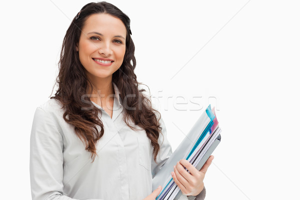 Portrait brunette fichiers blanche sourire [[stock_photo]] © wavebreak_media